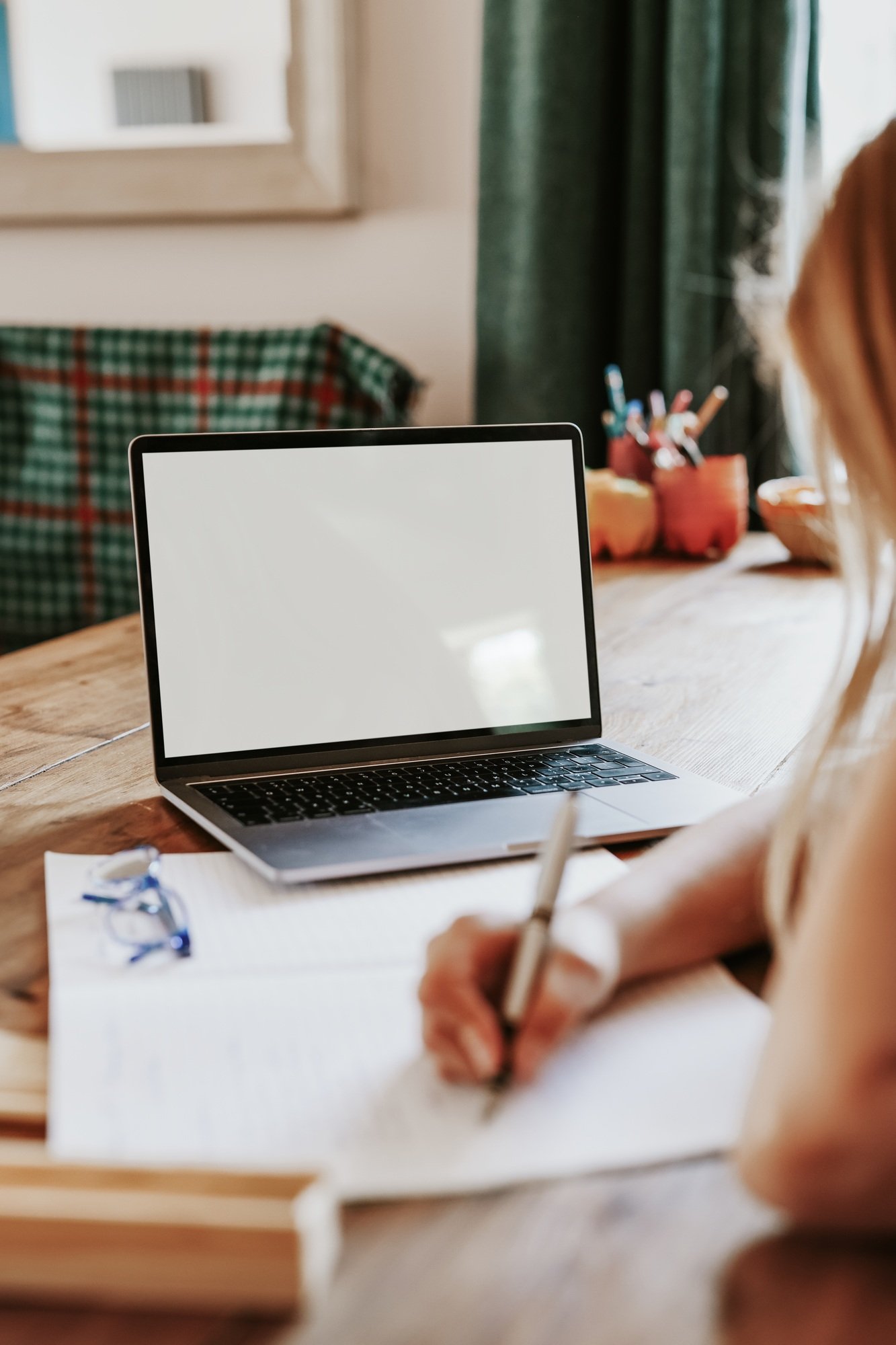 Blond girl using laptop for online class, the new normal